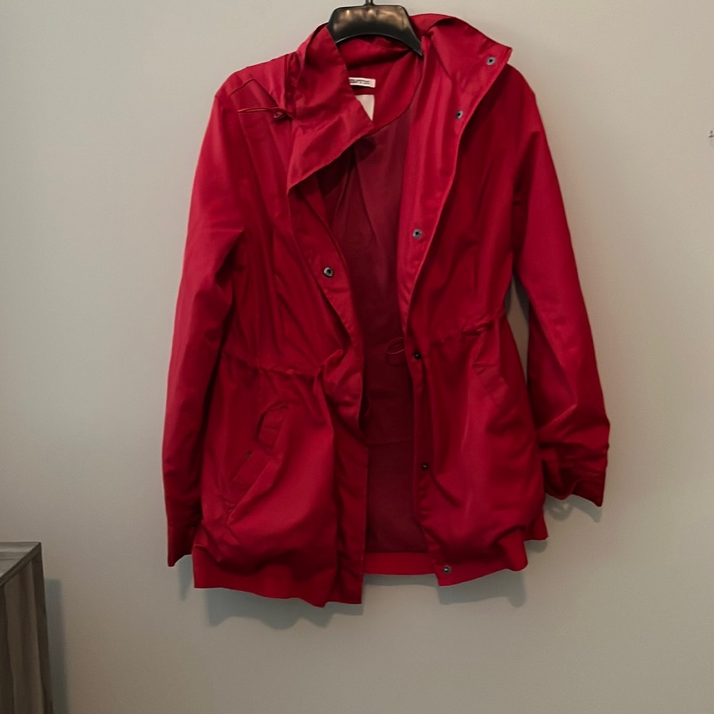 Red rain jacket with jersey knit interior and cinched waist